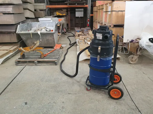Dirt Eater HEPA industrial vacuum in action on a Houston jobsite