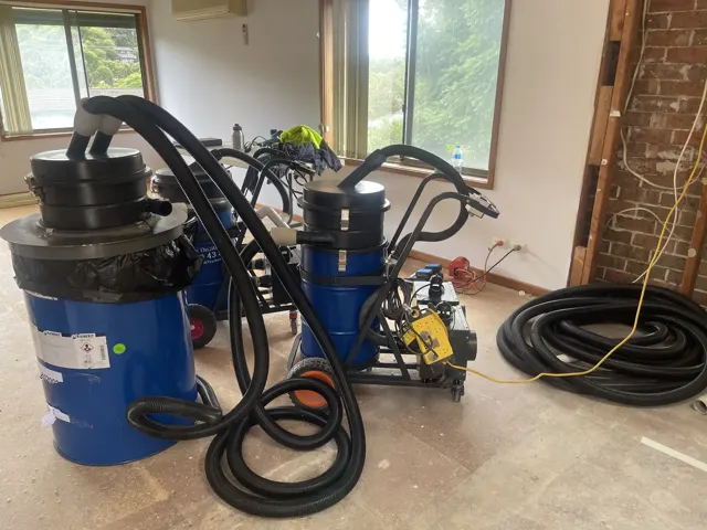 Dirt Eater HEPA industrial vacuum in action on a Houston jobsite