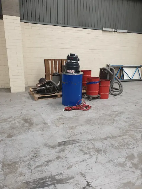 Dirt Eater HEPA industrial vacuum in action on a Houston jobsite