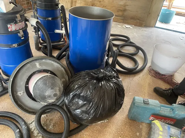 HireAVac HEPA industrial vacuum equipment collecting hazardous dust