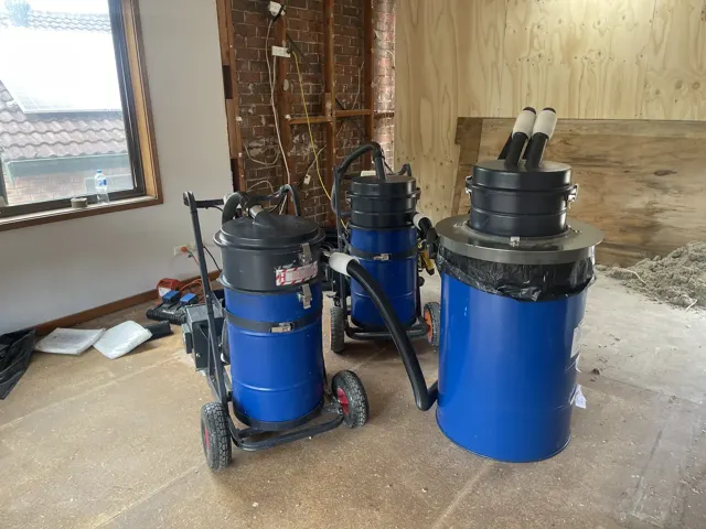 Dirt Eater HEPA industrial vacuum in action on a Houston jobsite