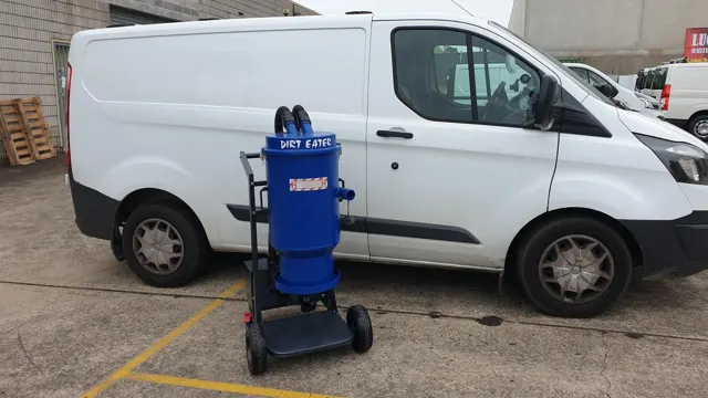 Dirt Eater Jr compact HEPA industrial vacuum in action on a jobsite